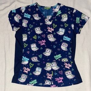 Blue scrub top nursing with owls